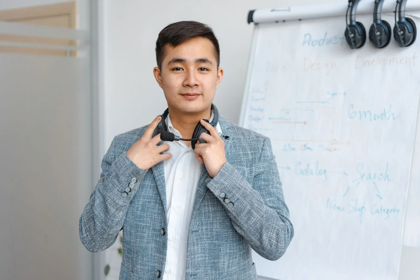 Portrait of a young man with a headset in a modern office environment