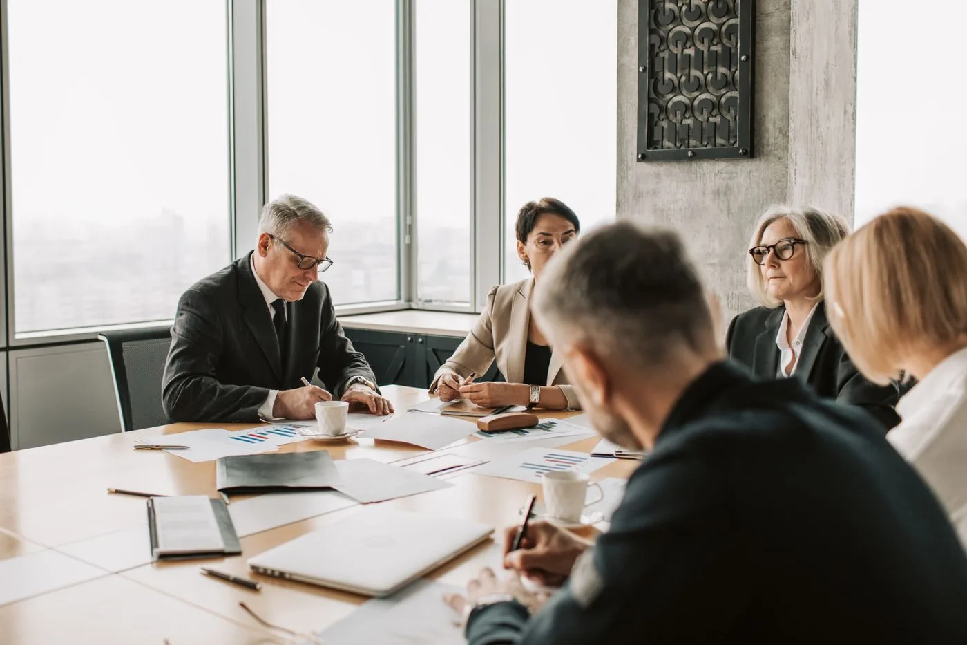 Business professionals engaged in a collaborative meeting around a conference table
