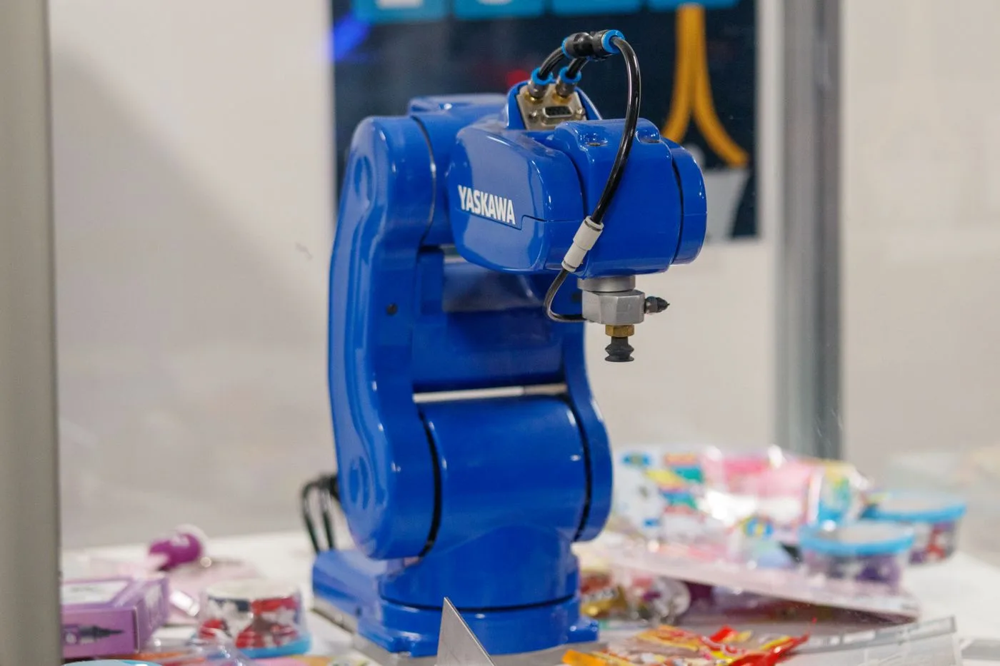 A blue Yaskawa industrial robot arm on display