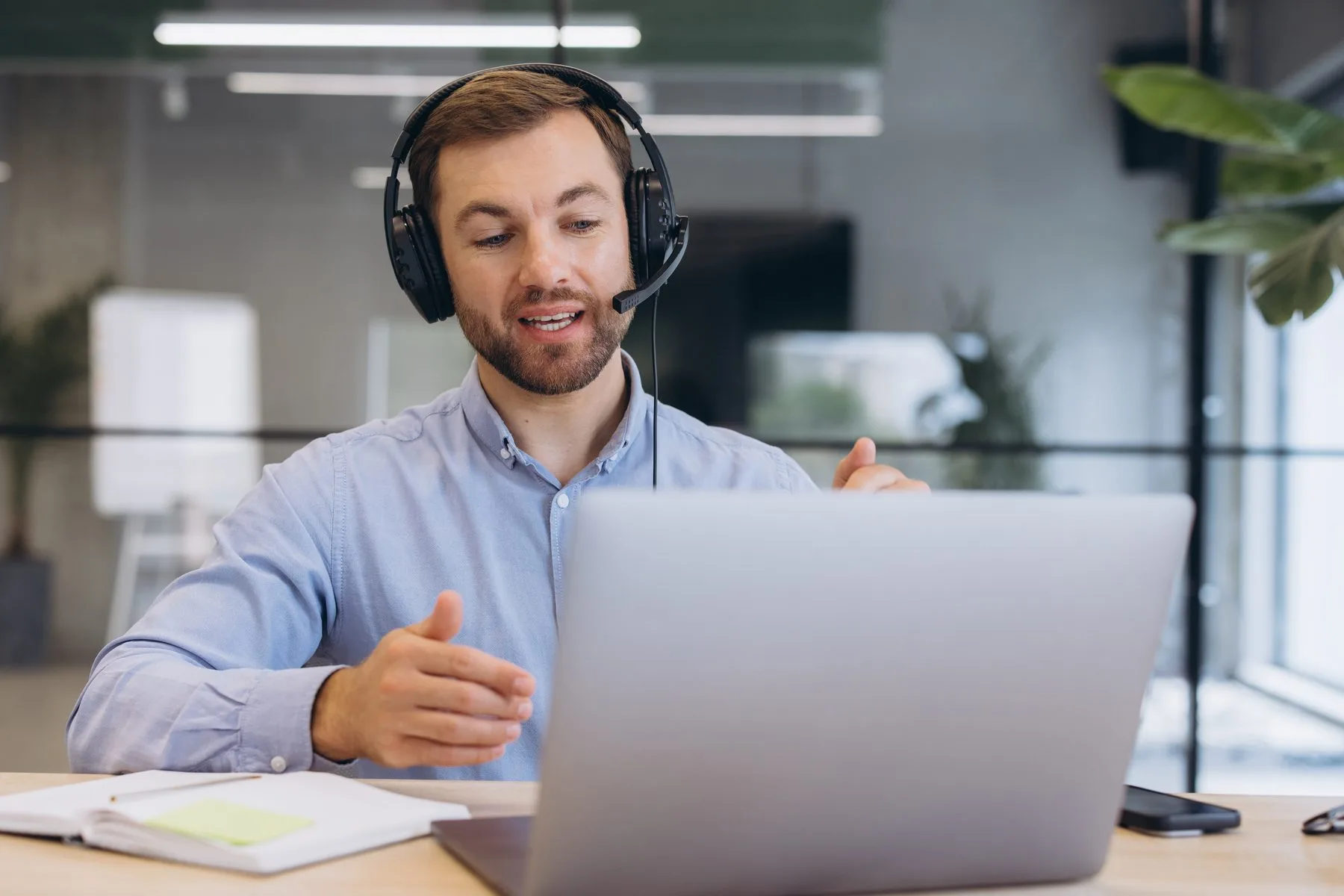 Professional man wearing headset having video call