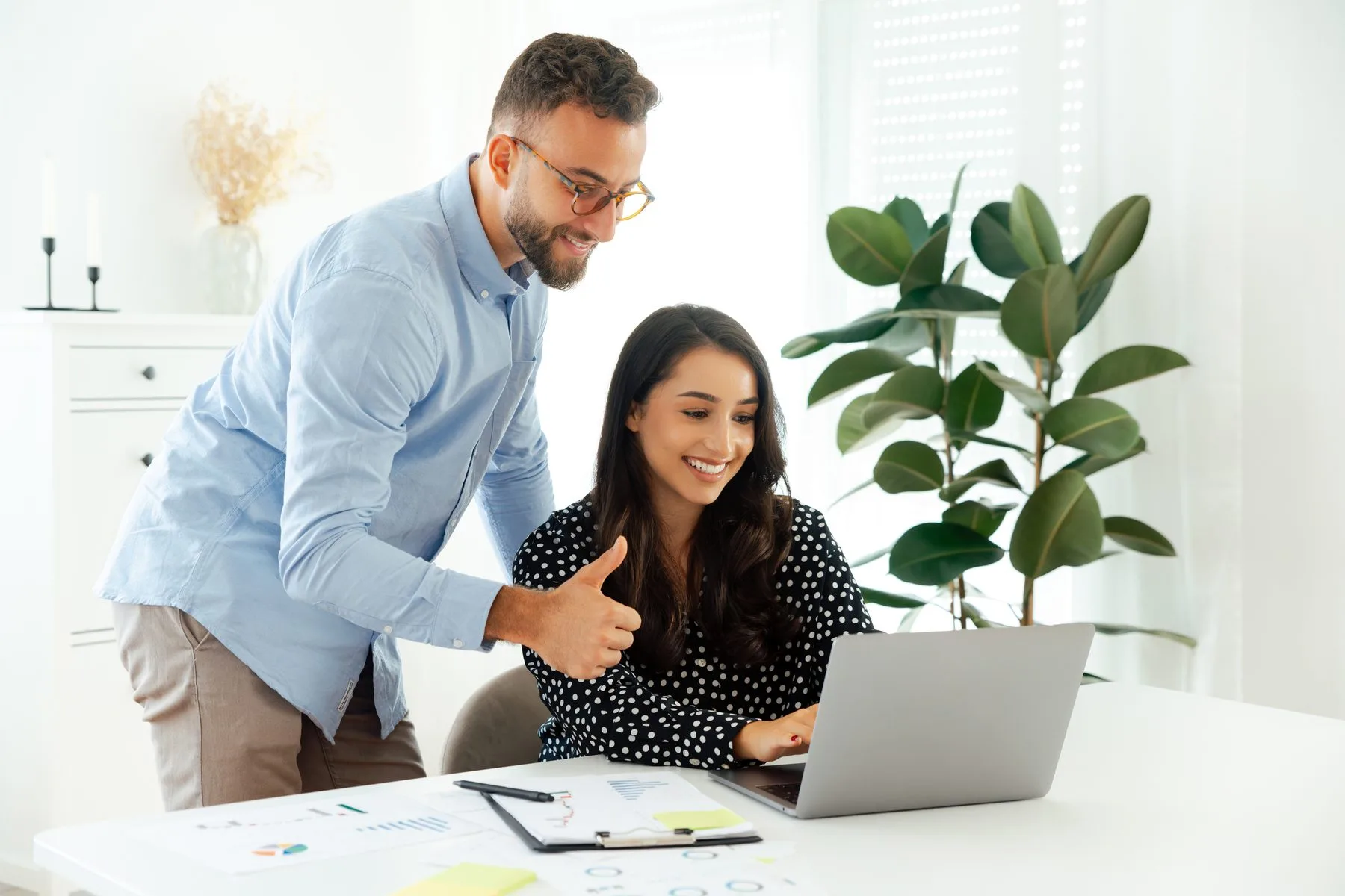 Cheerful colleagues working together in modern off