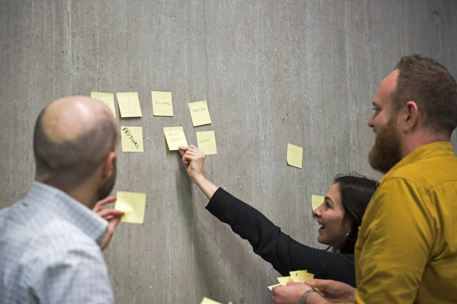 Collaborative team brainstorming ideas on concrete