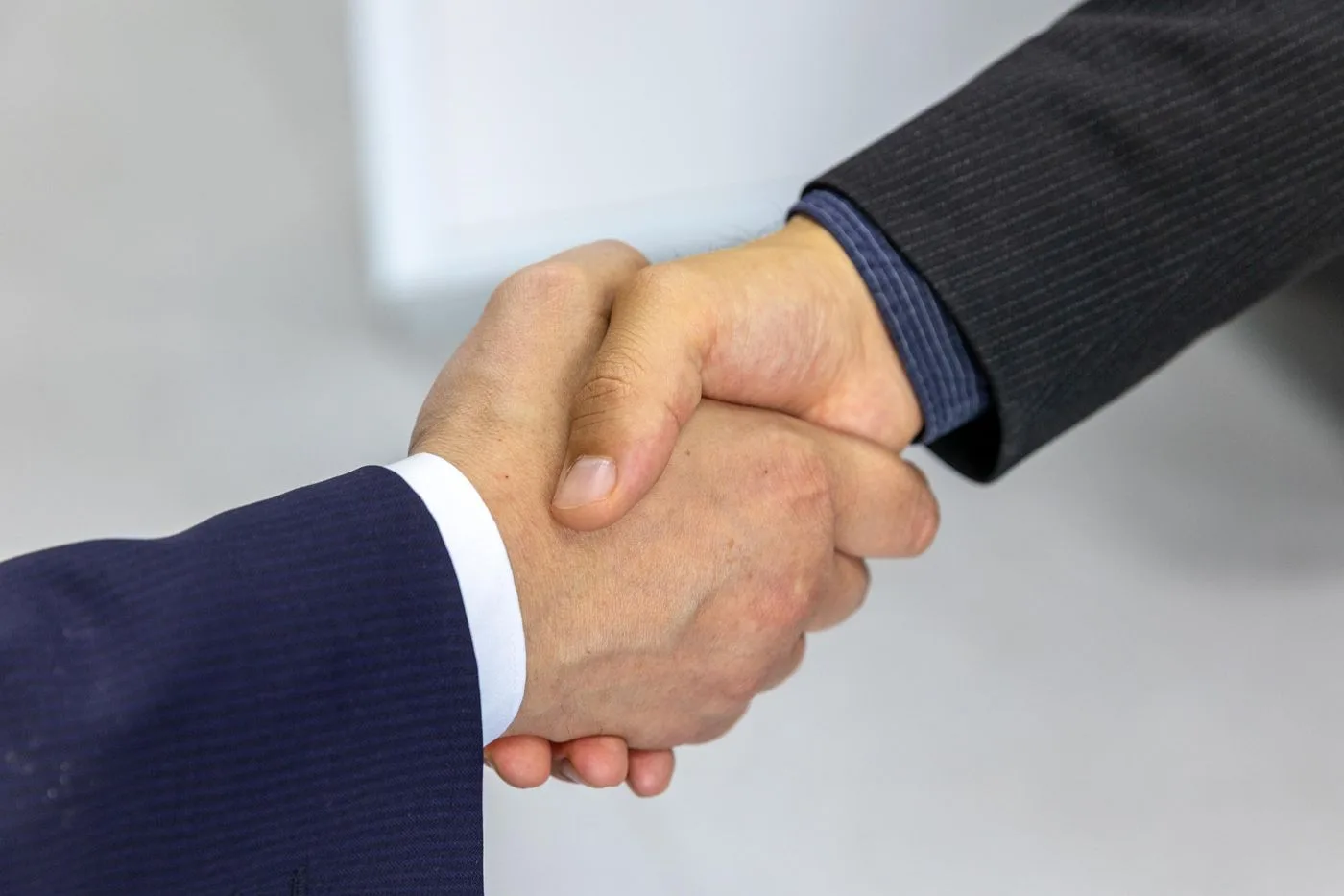 Close-up of two businessmen shaking hands
