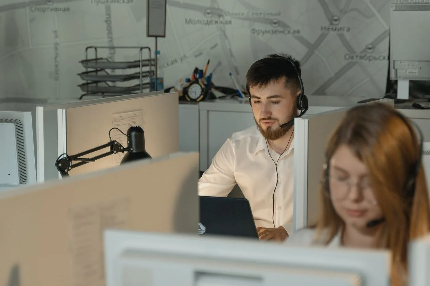 Dedicated call center agents working diligently at their desks in an office